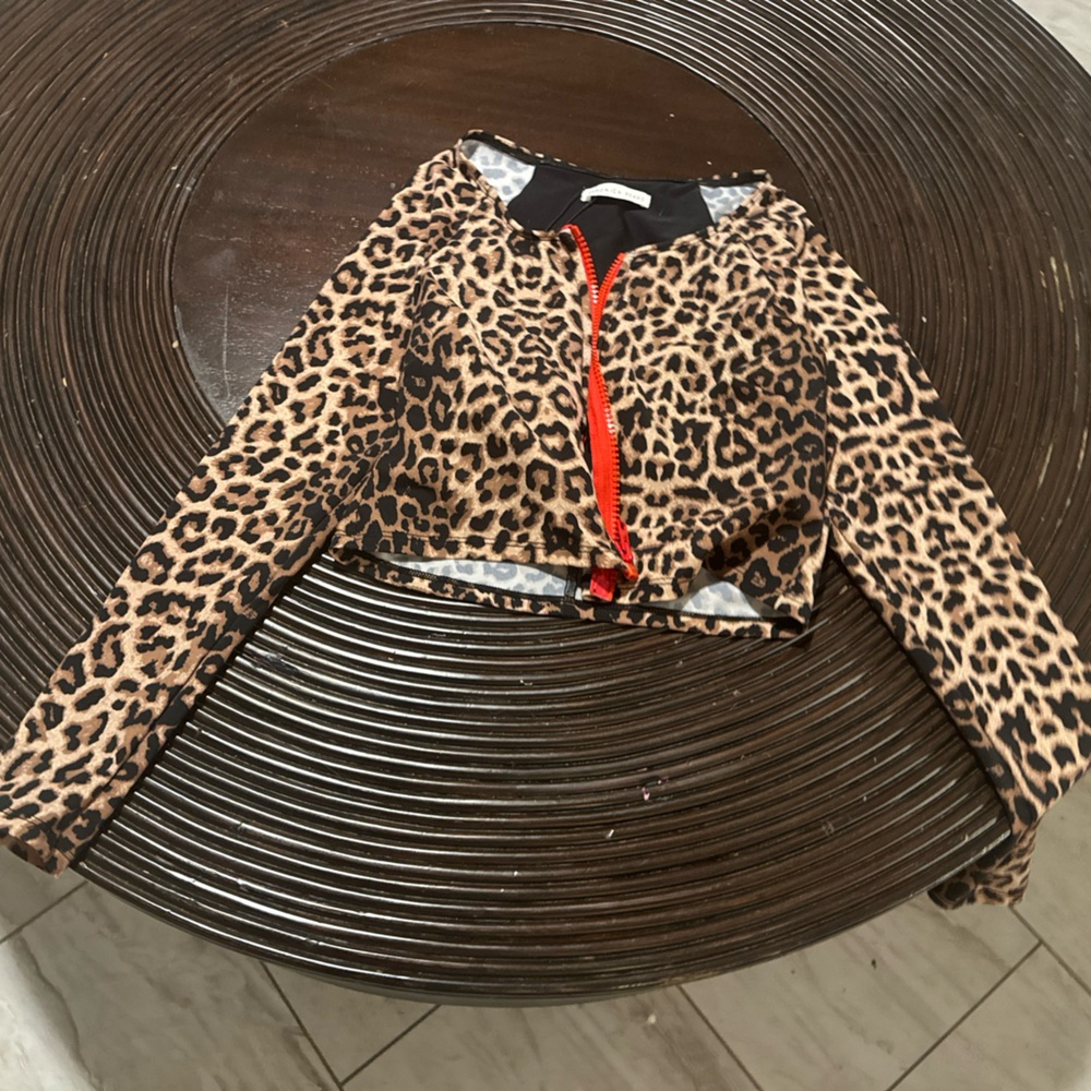 Designer top size large but runs small